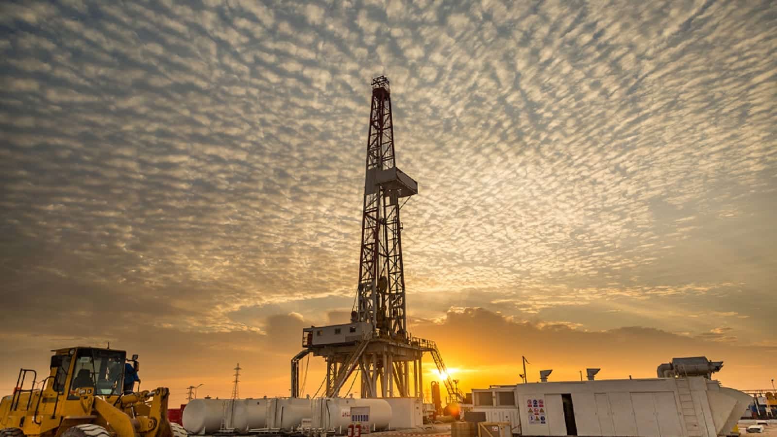 Oil Fracking Drill Rig at Sunset